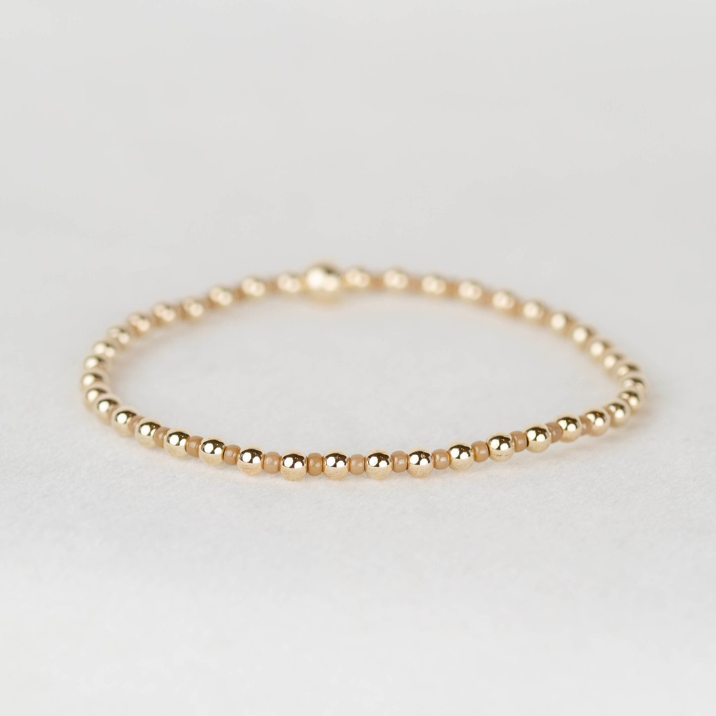 Tan nude Bella seed bead alternating with 14k gold filled or sterling silver beaded stretch bracelet