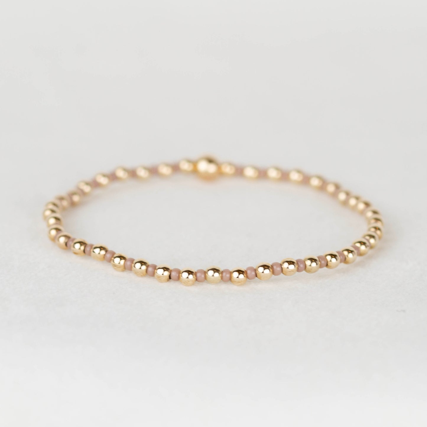 Mauve neutral nude Bella seed bead alternating with 14k gold filled or sterling silver beaded stretch bracelet