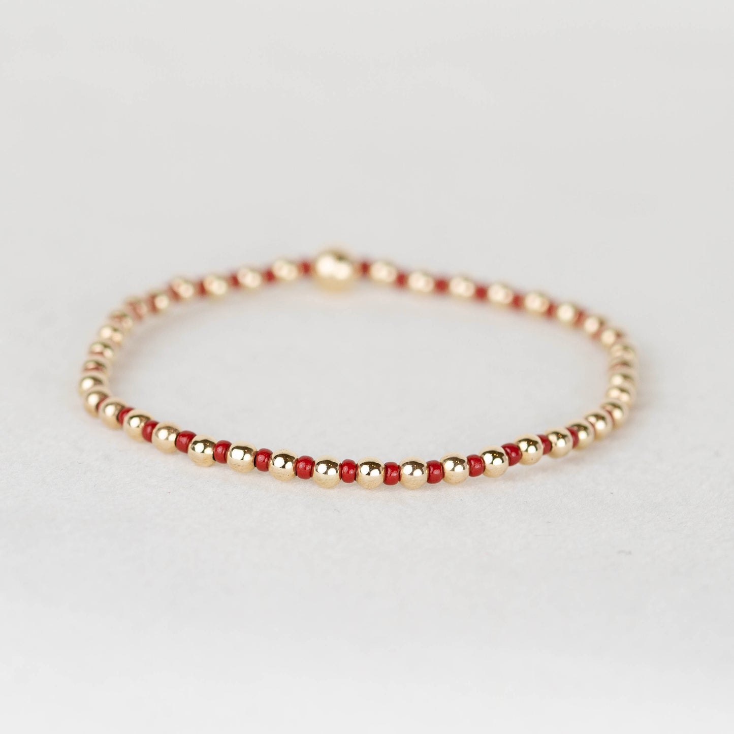Dark wine red burgundy maroon Bella seed bead alternating with 14k gold filled or sterling silver beaded stretch bracelet