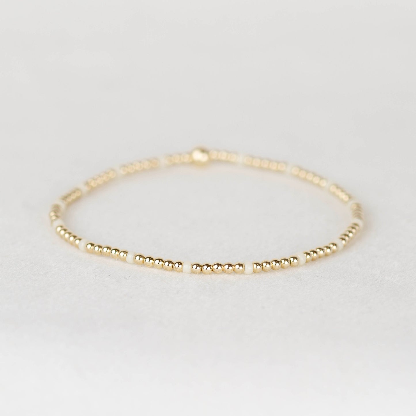 Cream white Chloe seed bead and 14k gold filled or sterling silver beaded stretch bracelet 
