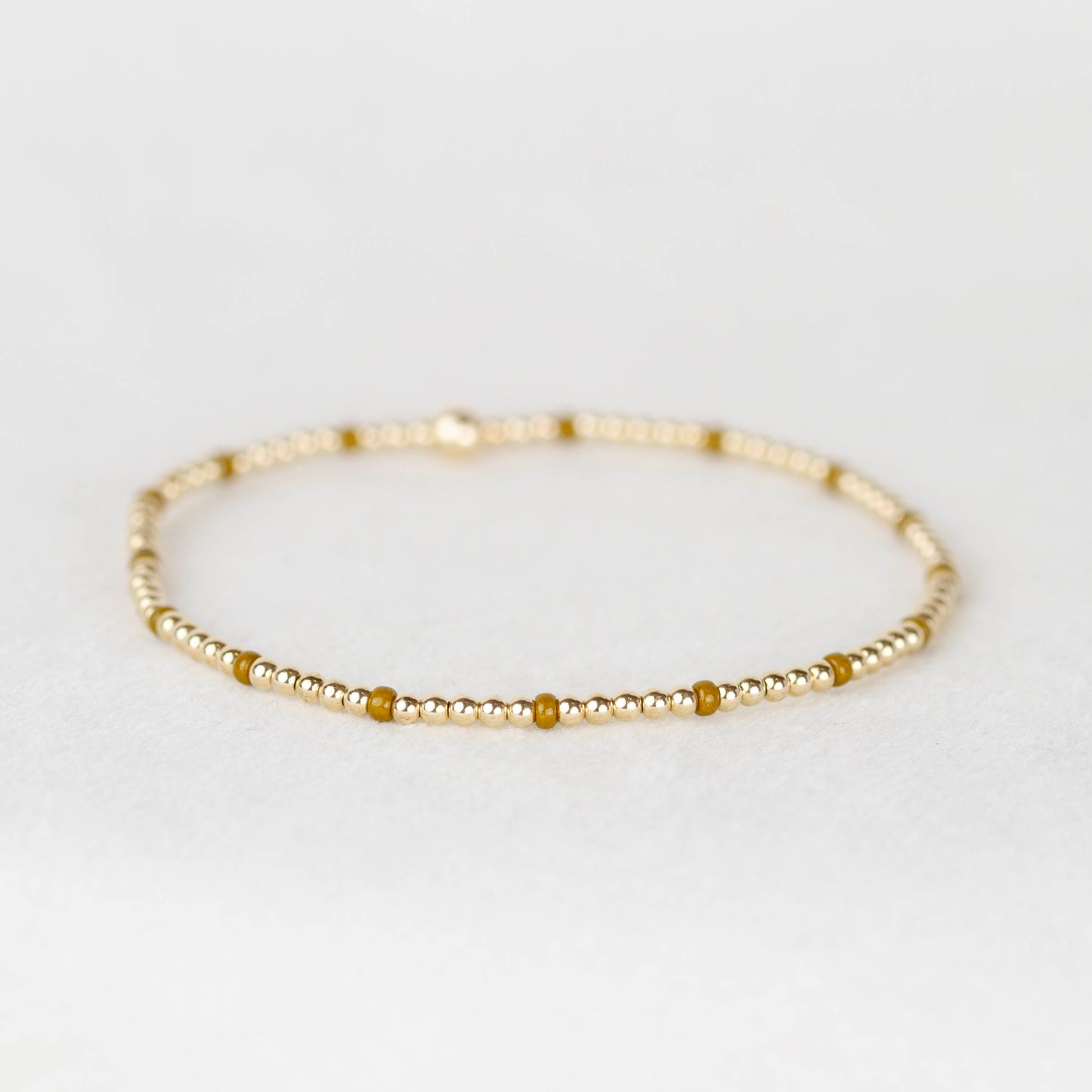 Dark yellow dijon Chloe seed bead and 14k gold filled or sterling silver beaded stretch bracelet 