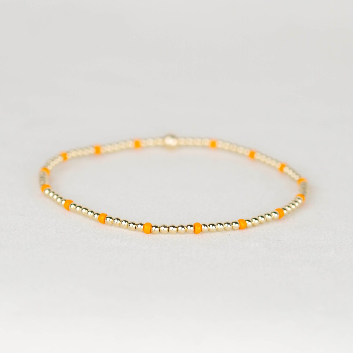 light orange Chloe seed bead and 14k gold filled or sterling silver beaded stretch bracelet 