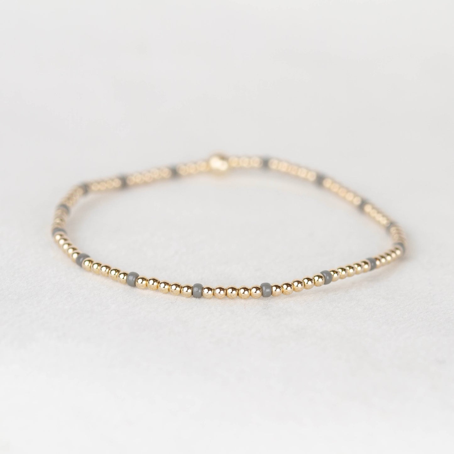 Dark gray Chloe seed bead bracelet with 14k gold filled or sterling silver beaded stretch bracelet 
