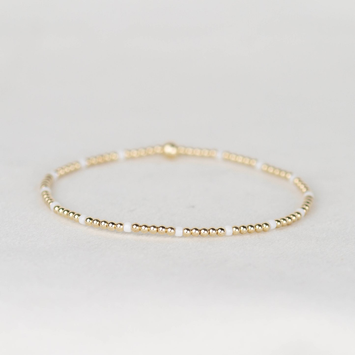 White Chloe seed bead bracelet with 14k gold filled or sterling silver beaded stretch bracelet 
