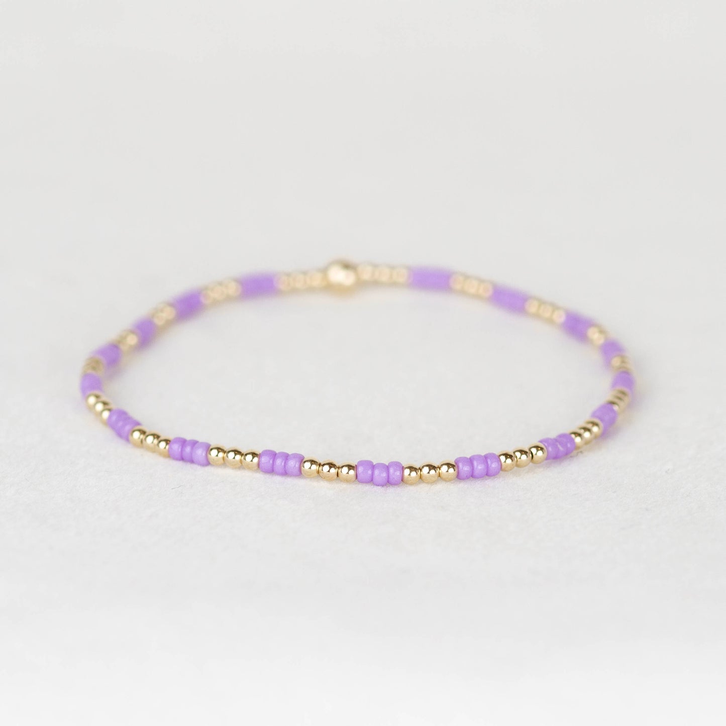 Light amethyst purple Madi seed bead alternating with 14k gold filled or sterling silver beaded stretch bracelet 