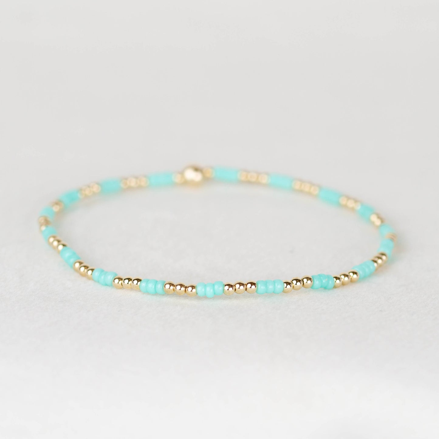 Aqua green blue Madi seed bead alternating with 14k gold filled or sterling silver beaded stretch bracelet 