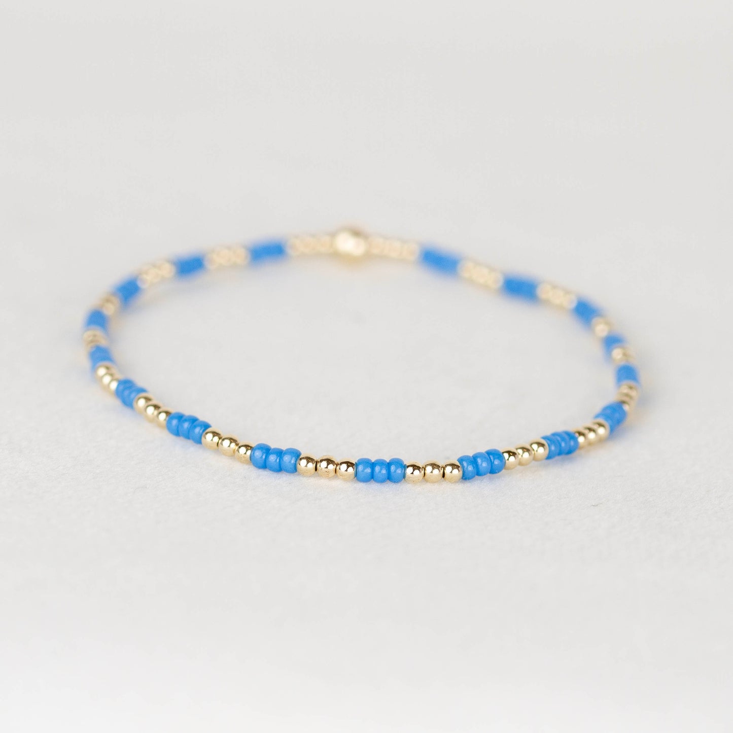 Blue Madi seed bead alternating with 14k gold filled or sterling silver beaded stretch bracelet 