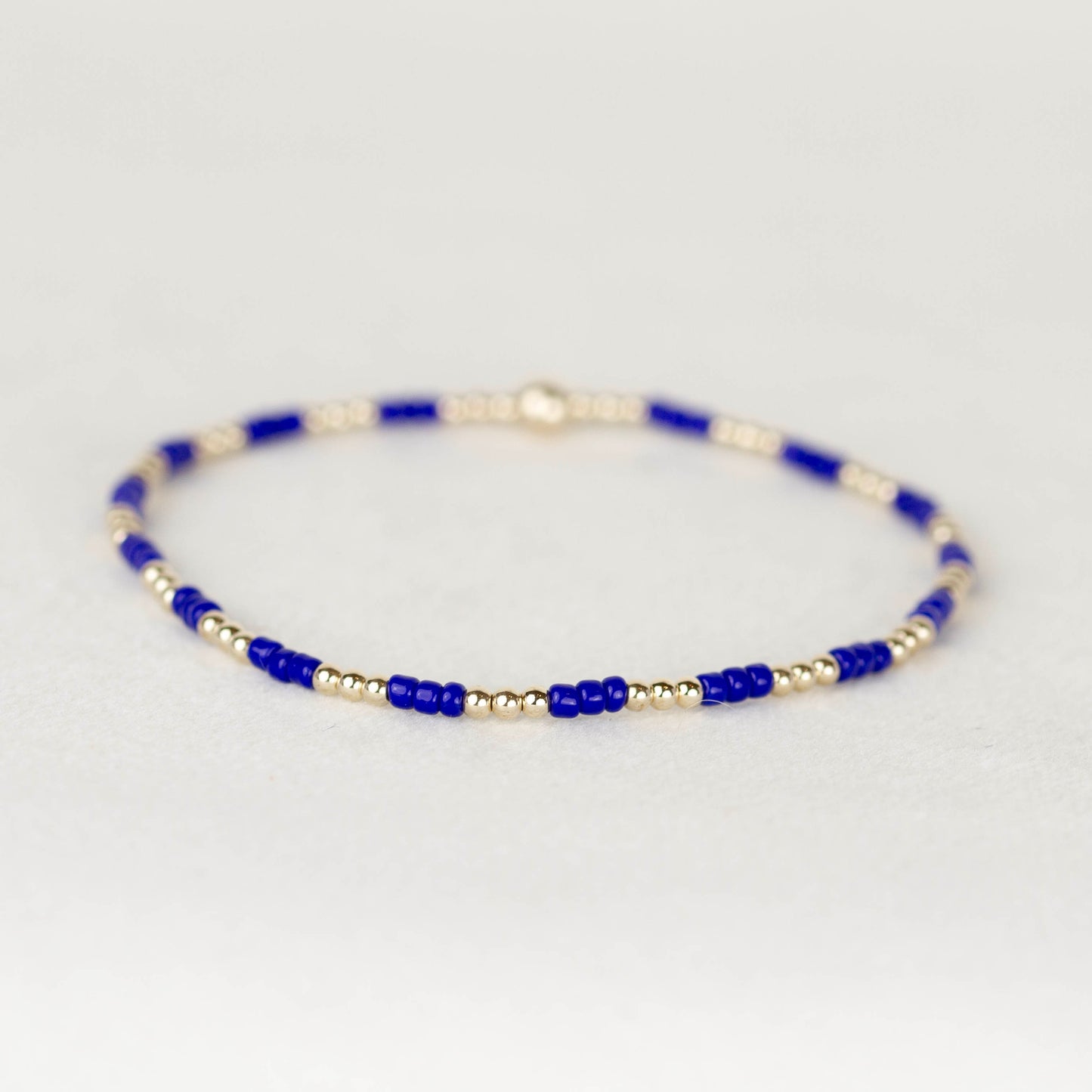 Cobalt blue Madi seed bead alternating with 14k gold filled or sterling silver beaded stretch bracelet 