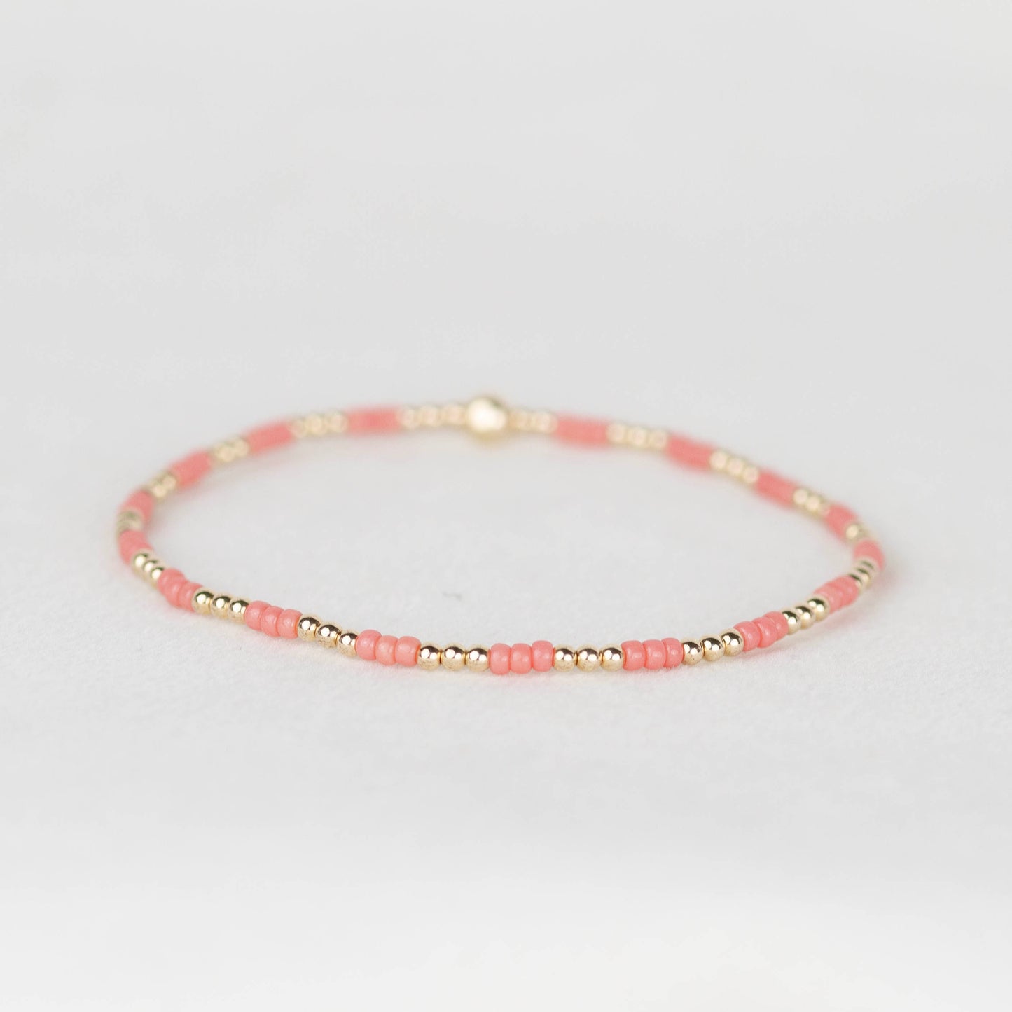 Coral pink Madi seed beads and 14k gold filled or sterling silver beaded stretch bracelet