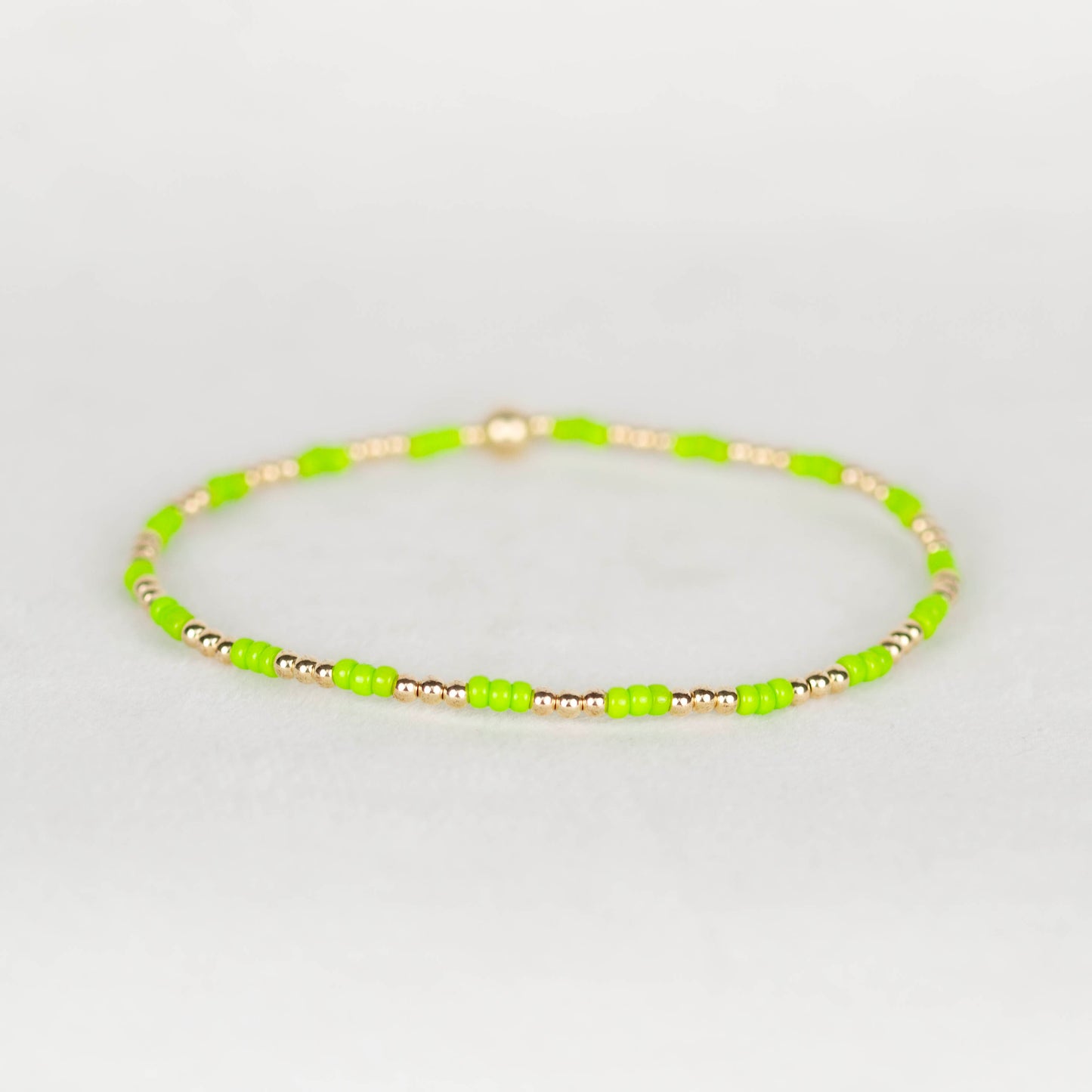 Lemon lime green Madi seed bead alternating with 14k gold filled or sterling silver beaded stretch bracelet 