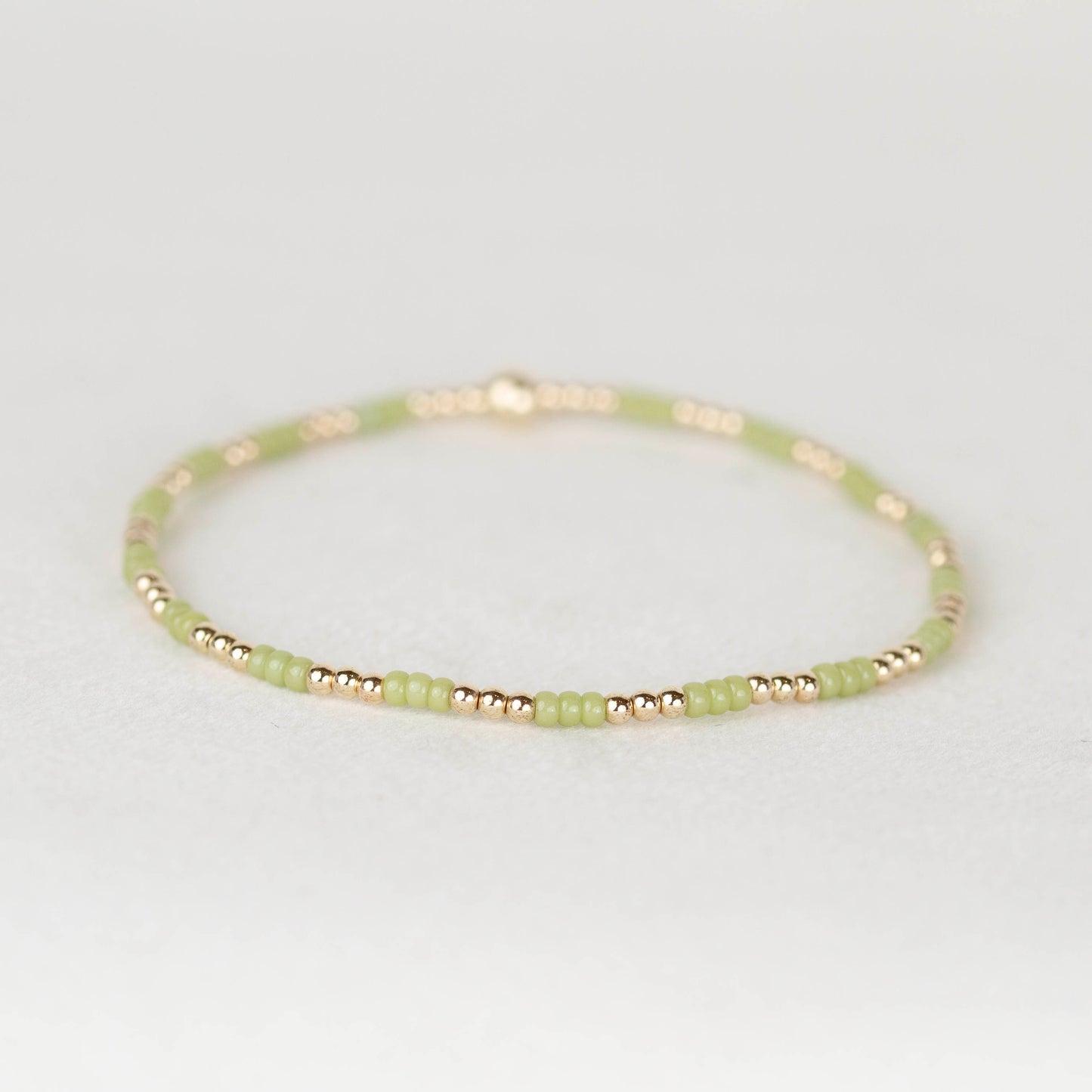 Olive green Madi seed bead alternating with 14k gold filled or sterling silver beaded stretch bracelet 