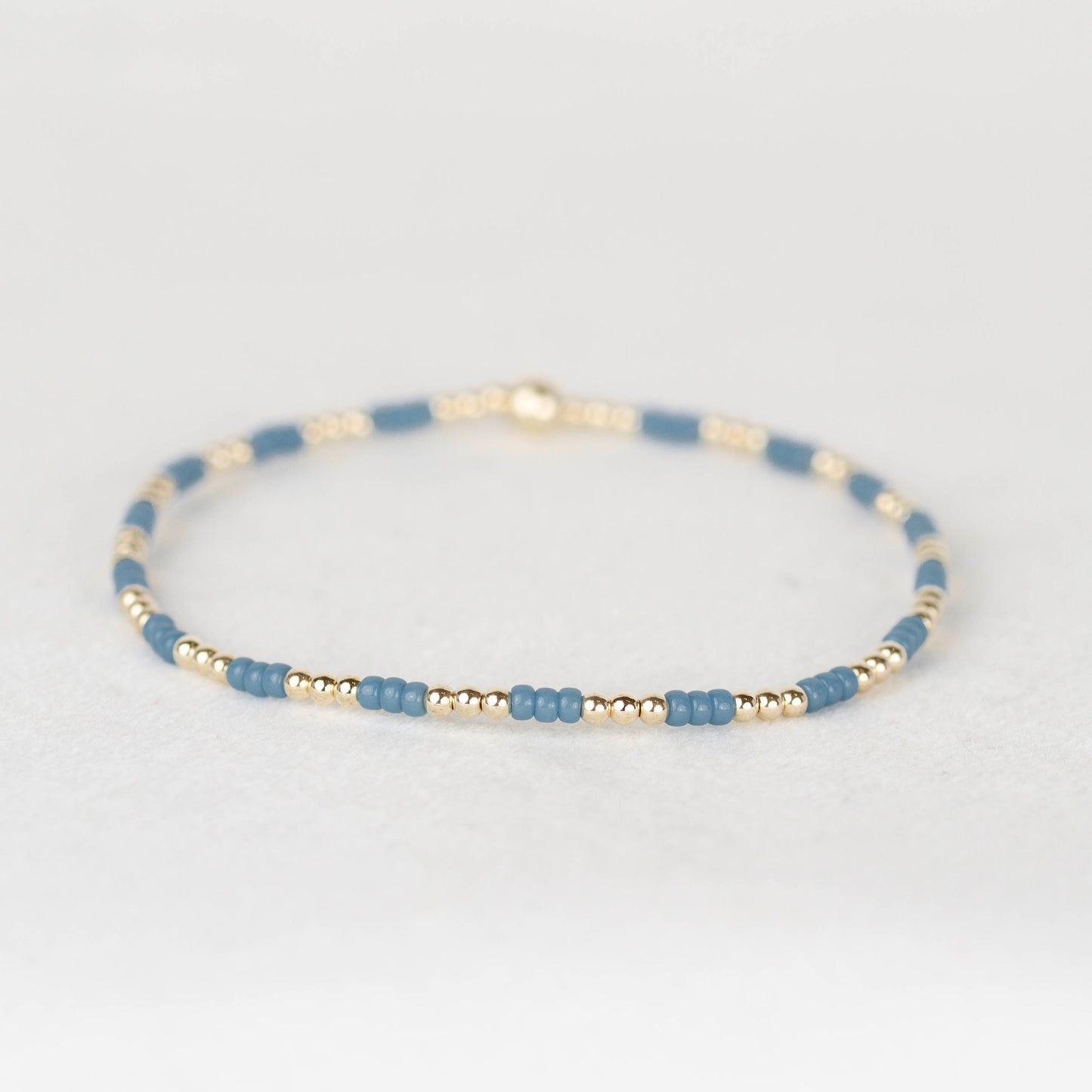 Steel muted blue Madi seed bead alternating with 14k gold filled or sterling silver beaded stretch bracelet 