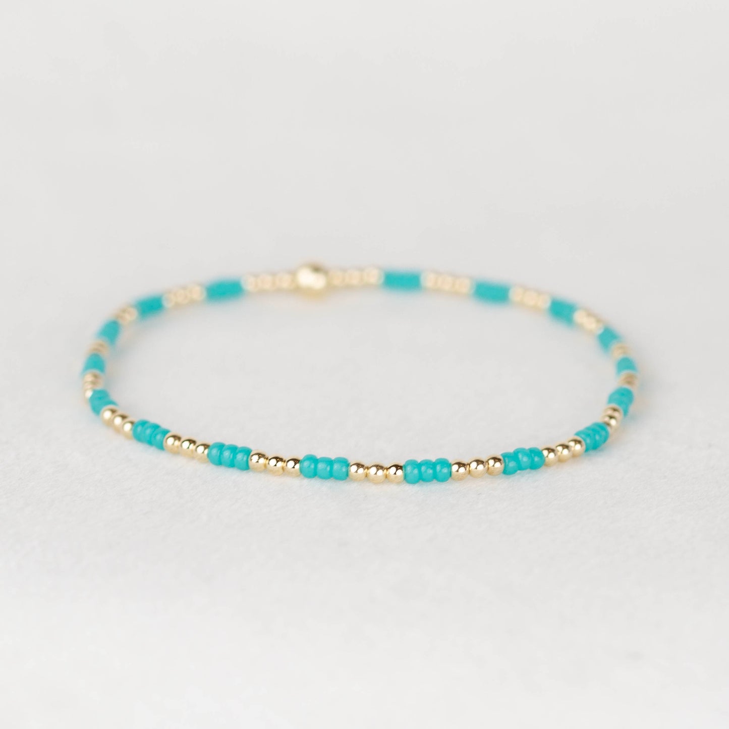 Turquoise blue green Madi seed bead alternating with 14k gold filled or sterling silver beaded stretch bracelet 