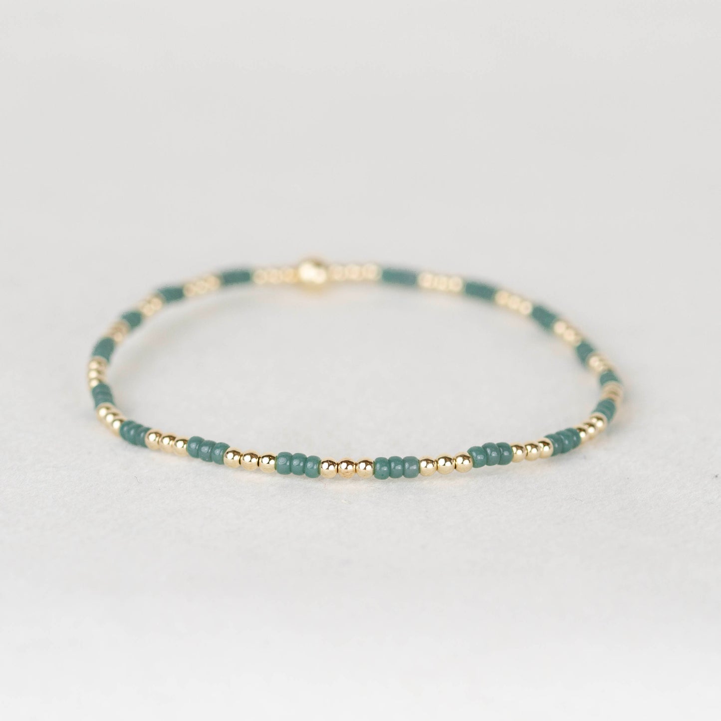 Wintergreen soft green Madi seed bead alternating with 14k gold filled or sterling silver beaded stretch bracelet 
