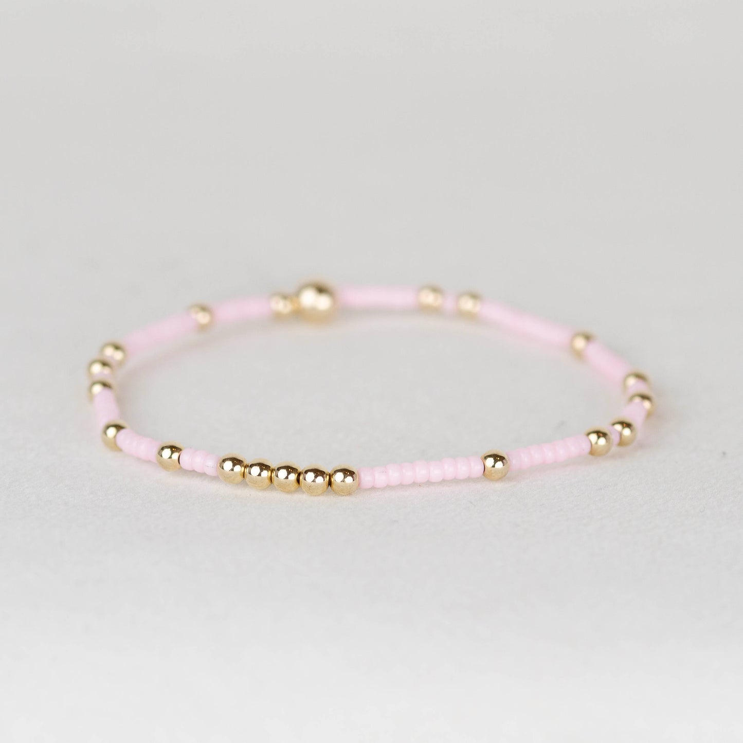 Light Pink Olivia seed bead with scattered 14k gold filled or sterling silver beaded stretch bracelet 