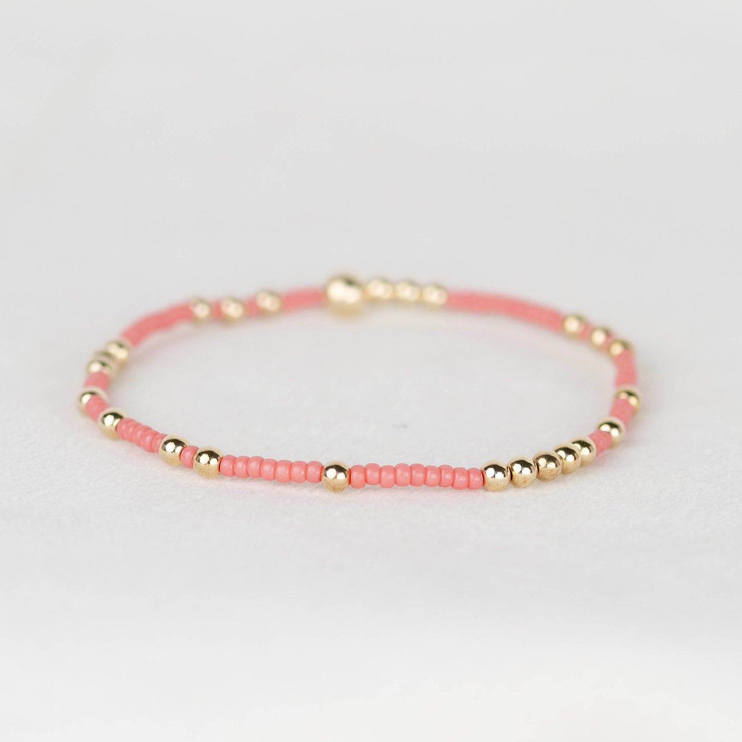 Coral Olivia seed bead with scattered 14k gold filled or sterling silver beaded stretch bracelet 
