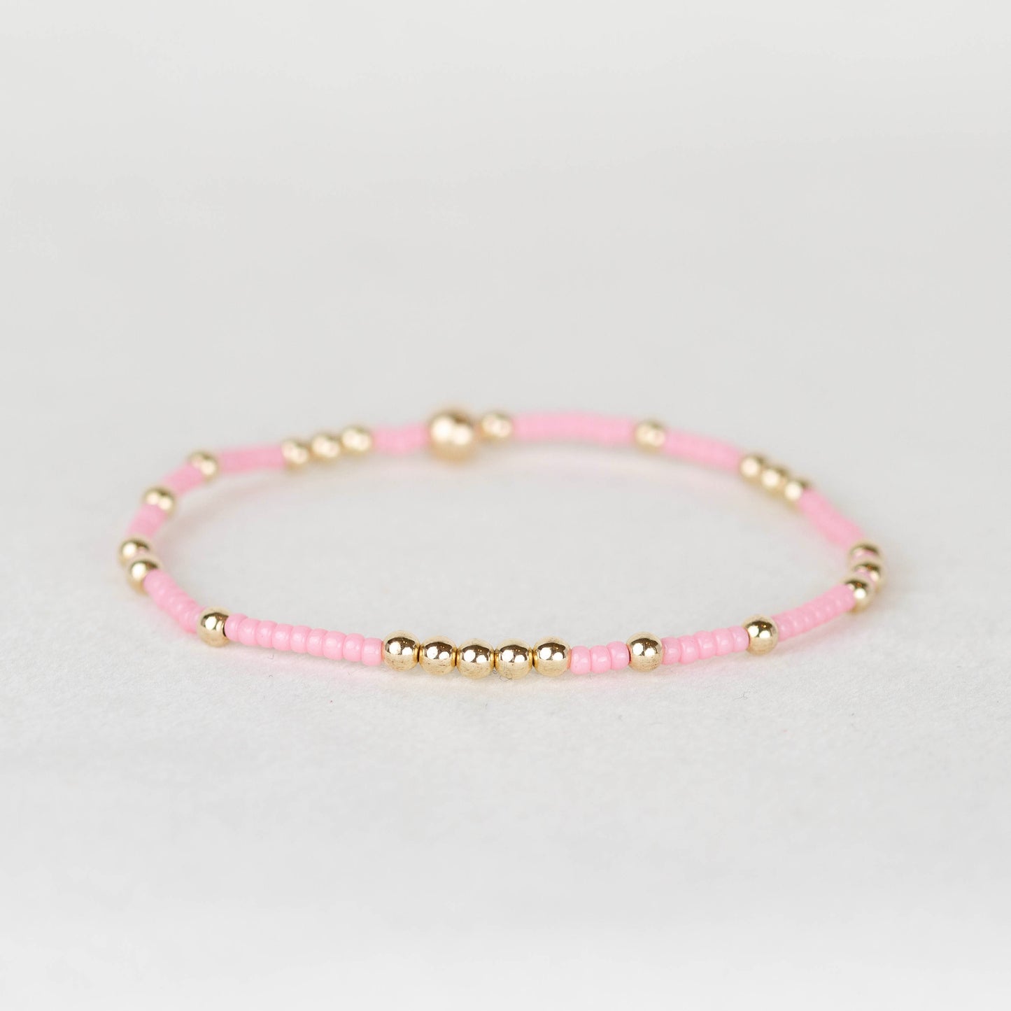 Light pink Olivia seed bead with scattered 14k gold filled or sterling silver beaded stretch bracelet 