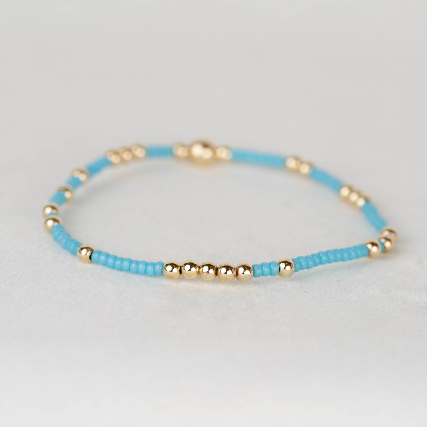 blue Olivia seed bead scattered with 14k gold filled or sterling silver beaded stretch bracelet 