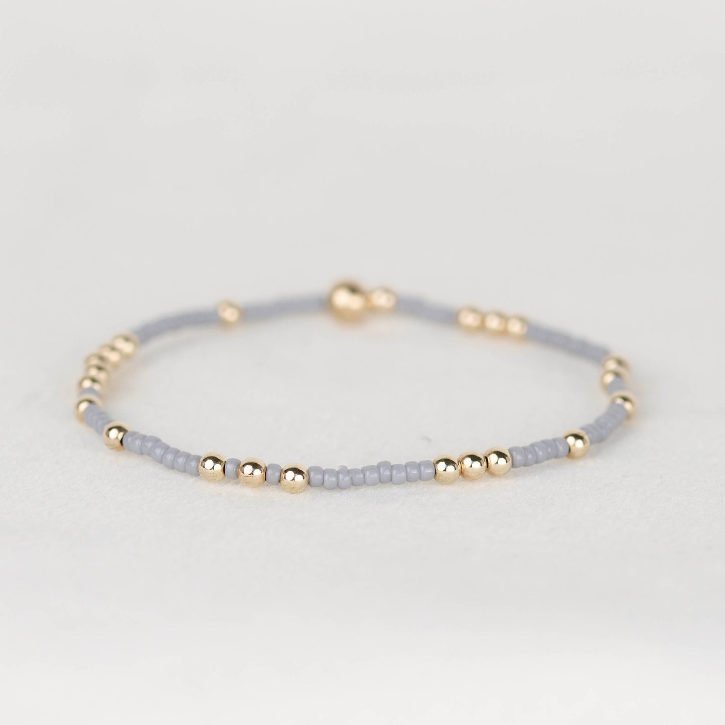 Gray Olivia seed bead with scattered 14k gold filled or sterling silver beaded stretch bracelet 
