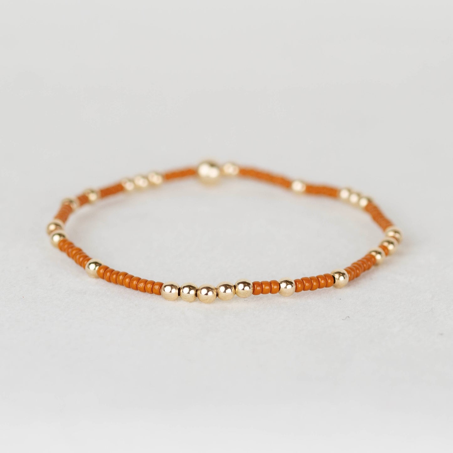 Burnt Orange Ginger Olivia seed bead with scattered 14k gold filled or sterling silver beaded stretch bracelet 