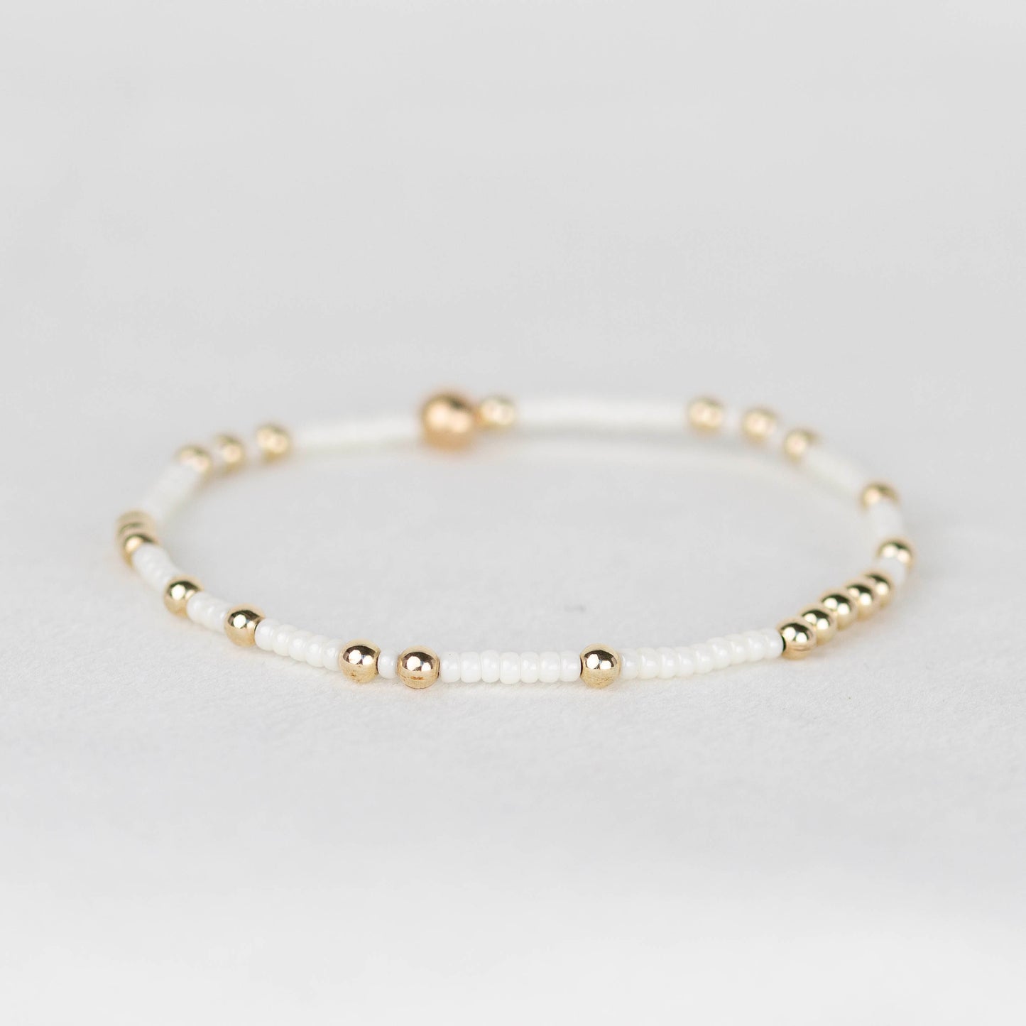 Pearl white Olivia seed bead stretch bracelet with 14k gold filled or sterling silver 
