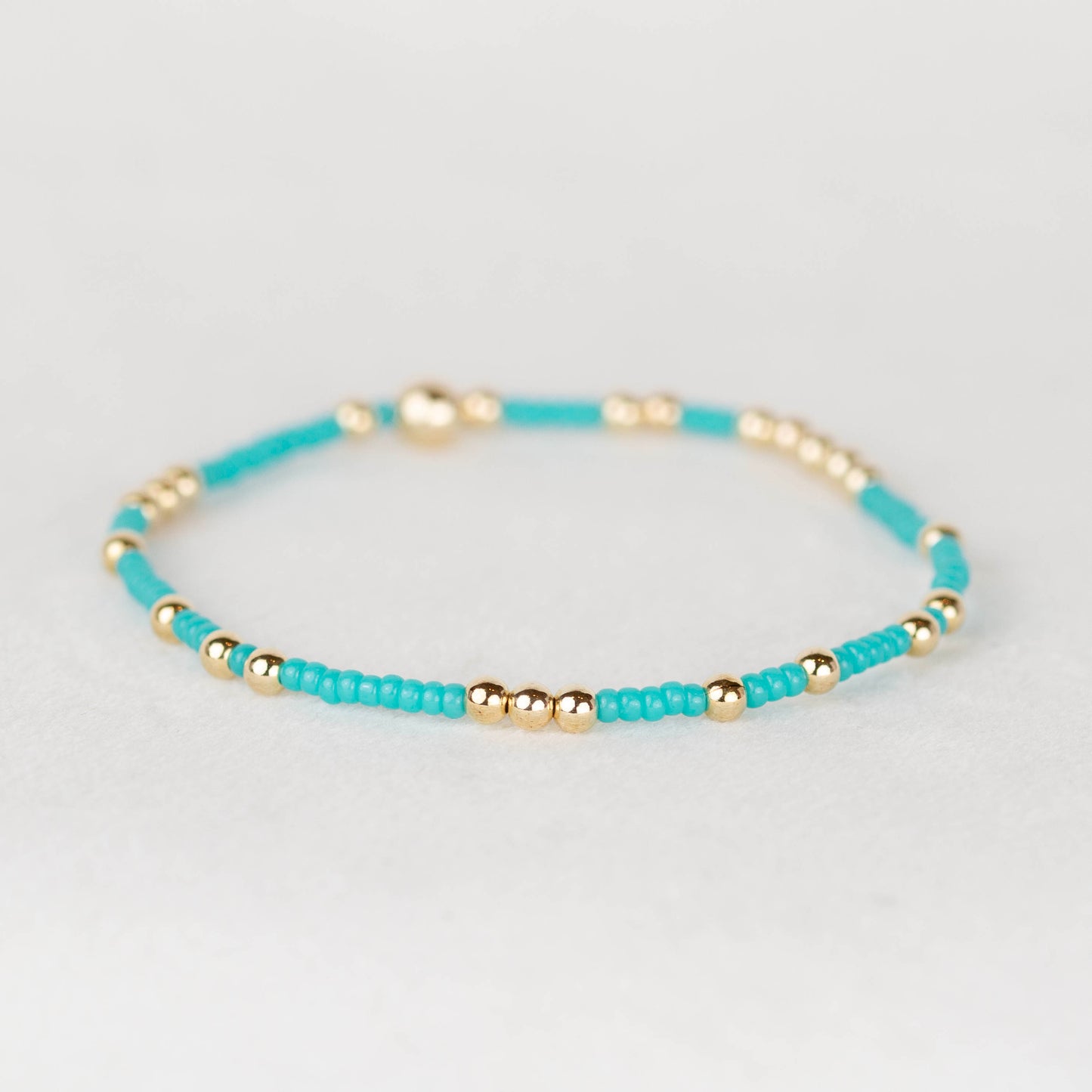 Turquoise Olivia seed bead with scattered 14k gold filled or sterling silver beaded stretch bracelet 