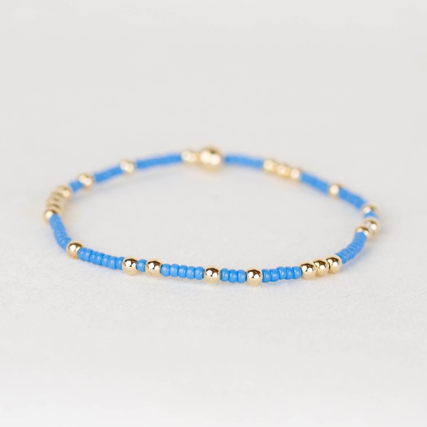 Blue Olivia seed bead with scattered 14k gold filled or sterling silver beaded stretch bracelet 
