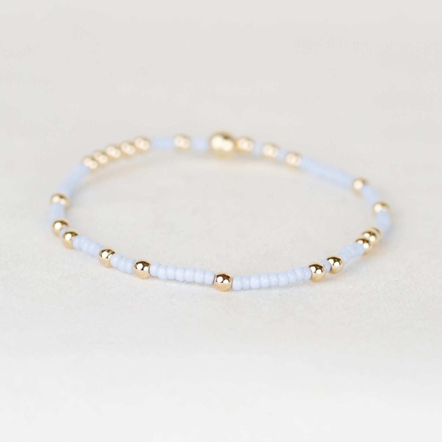 pale light blue Olivia seed bead with scattered 14k gold filled or sterling silver beaded stretch bracelet 