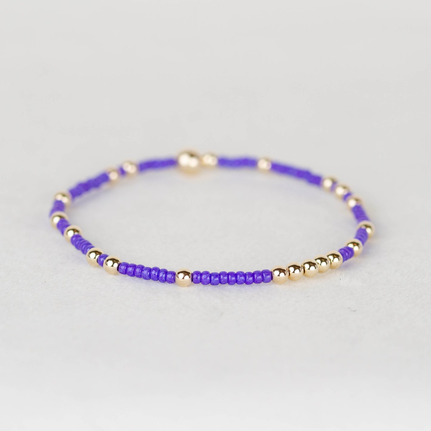 Bright purple Olivia seed bead with scattered 14k gold filled or sterling silver beaded stretch bracelet 
